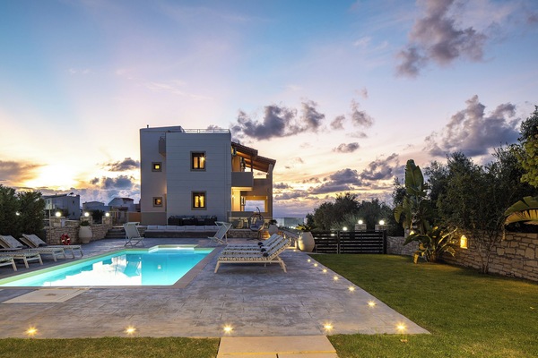 The pool area glows beautifully at night with ambient lighting
