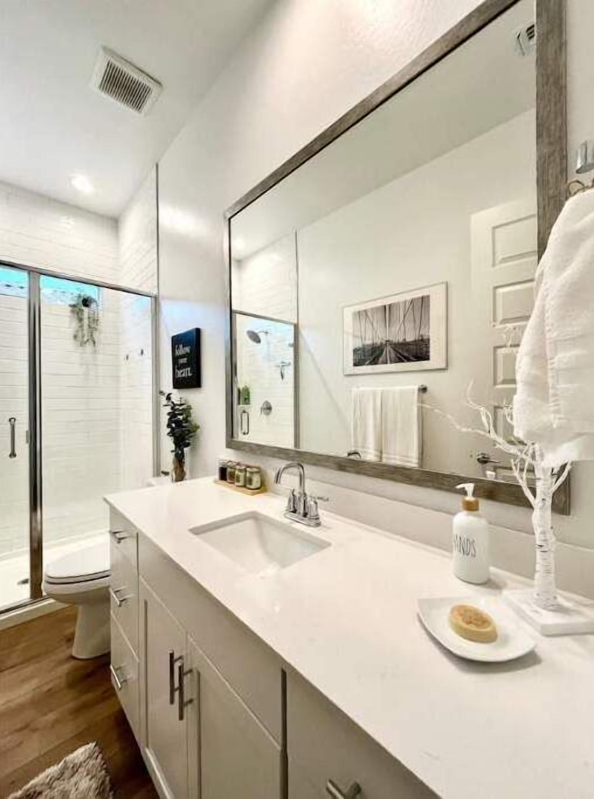 Shower, hair dryer, towels, toilet paper