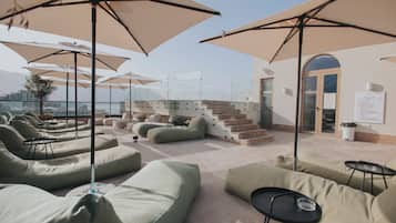 Seasonal outdoor pool, pool umbrellas, pool loungers