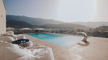 Seasonal outdoor pool, pool umbrellas, sun loungers