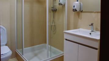 Rainfall showerhead, towels, soap, shampoo