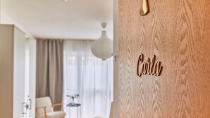 A modern living room with a wooden wall featuring a nameplate.