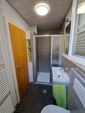 Shower, hair dryer, towels, soap