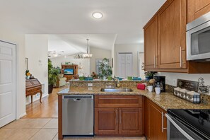 Fridge, microwave, oven, stovetop - Villa Millitta - Cozy 3BR home in SW Cape Coral quiet neighborhood - SWFL Rentals (Cape Coral)