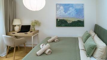 1 bedroom, desk, iron/ironing board, travel crib