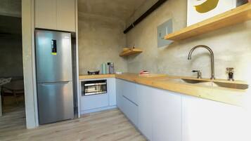 Fridge, microwave, stovetop, coffee/tea maker