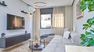 55-inch Smart TV with satellite channels, pay movies, heated floors