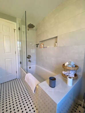 Shower, hair dryer, towels, soap