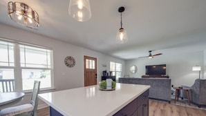 A spacious kitchen with a large island, wooden flooring, and pendant lighting. - 3-BR Cozy Mt. Holly River Retreat—USNWC—Fire Pit! (Mount Holly)