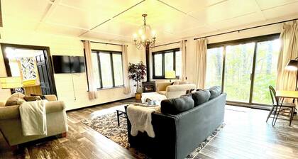 Private 2-cabin riverfront retreat in Brainerd, MN. Sleeps 13 across 4BR/3BA with full kitchen, fire pit, river sunsets. 10 min to town. Ideal for family reunions, group getaways & small gatherings.