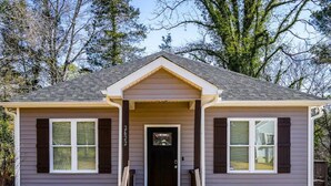 A single-story house with a front porch, a front door, and a mailbox. - NEW! Duke~King Bed~Speakeasy Hideout (Durham)