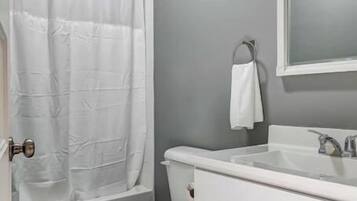 Shower, hair dryer, towels, shampoo