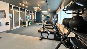 A gym with treadmills, weight machines, and free weights. - Aloft by Marriott McAllen (McAllen)
