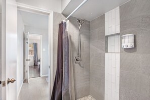 Shower, jetted bath, towels, soap