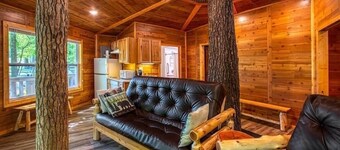 Tree House Deluxe Cabin w/bath - Glamping with real trees growing in the center of the cabin!
