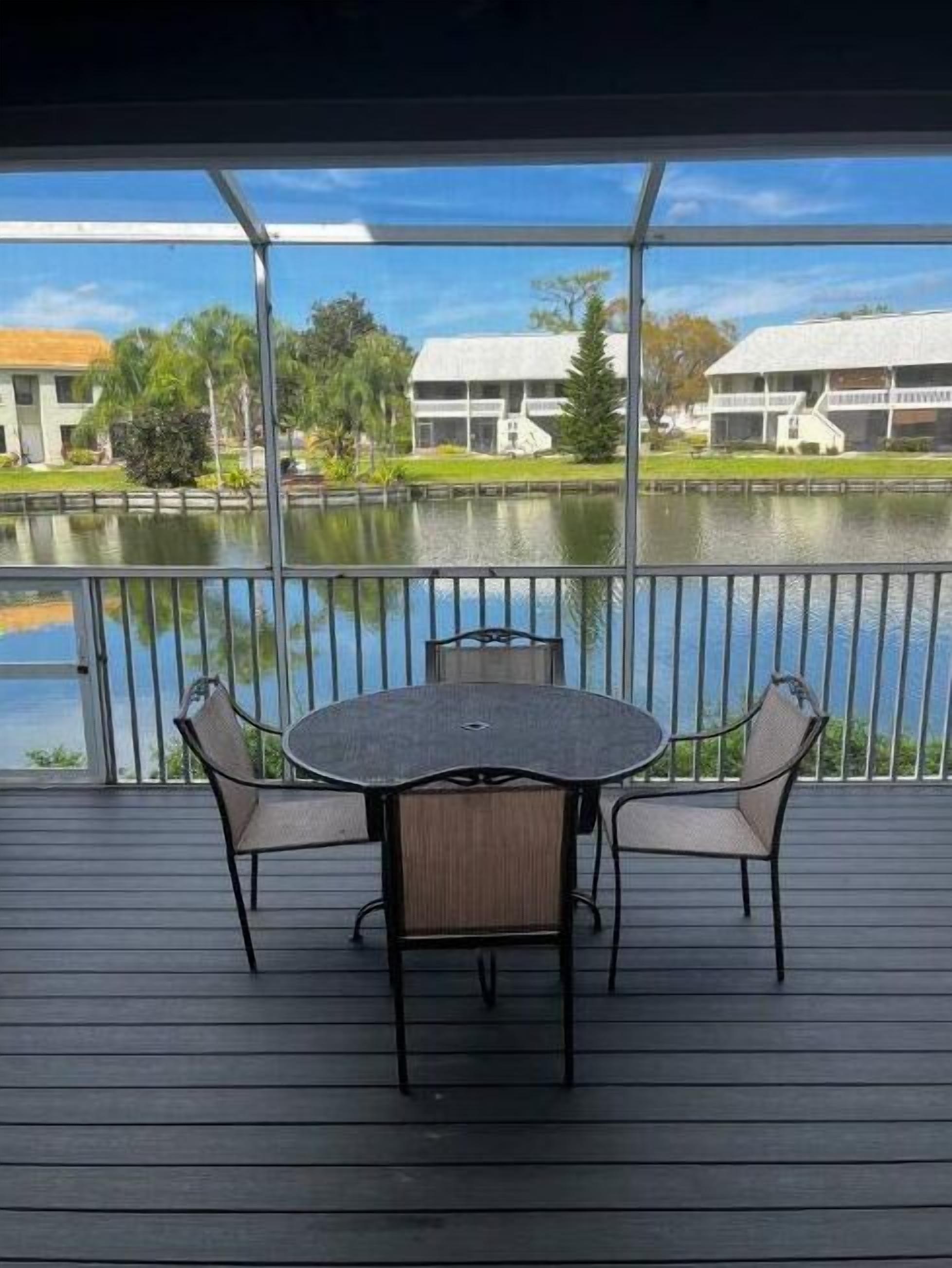 Screened in deck on the pond