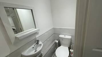 Shower, free toiletries, slippers, towels