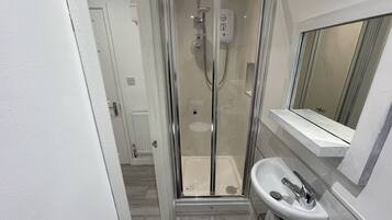 Shower, free toiletries, slippers, towels