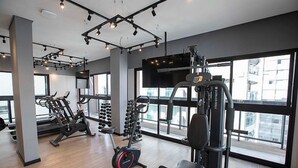 A modern gym with various exercise equipment, large windows, and a clean, spacious layout. - Studio Sao Paulo PUC Allianz Park 901WB (São Paulo)
