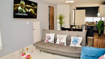 Exclusive House, Garden View | Living area | 55-inch Smart TV with cable channels, Netflix, streaming services