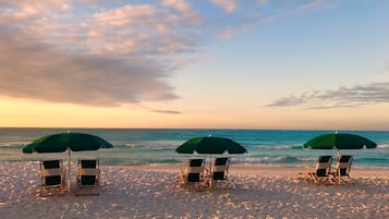 Go Beachfront view at dusk, offering a picturesque end to the day with waterfront seating.or a swim.