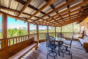 Relax in a serene outdoor space with a wooden deck and comfortable seating options.