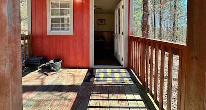 Welcome to our charming tiny house cabin at Blue Clouds Resort!