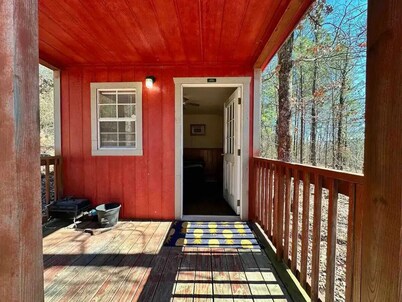 Welcome to our charming tiny house cabin at Blue Clouds Resort!