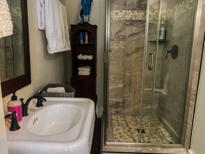 Shower, hair dryer, towels, soap