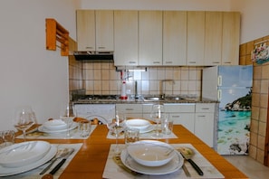 Fridge, microwave, stovetop, coffee/tea maker