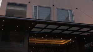 A multi-story building with a SureStay sign, indicating it is a hotel. - Surestay By Best Western Lucknow (Lucknow)