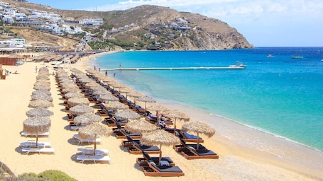 Beach nearby, white sand, sun loungers, beach umbrellas