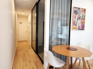 City Apartment | Living area | 50-inch LED TV with satellite channels - U Suites on Victoria (Wellington)