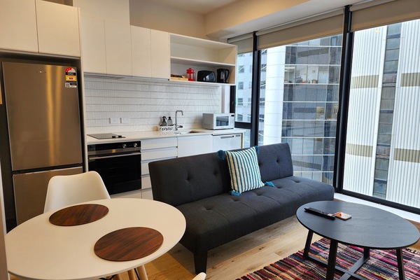 City Apartment | Living area | 50-inch LED TV with satellite channels