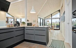 Fridge, stovetop, dishwasher, coffee/tea maker