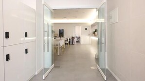 A modern hotel corridor with a dining area, a kitchen, and a bathroom. - JI STAY Hotel Gyeongju (Gyeongju)