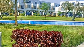 Outdoor pool, open 6:00 AM to 11:00 PM, pool umbrellas, pool loungers