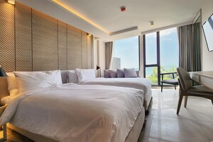 Quarto superior, 2 camas de solteiro, para não fumantes, vista para o oceano | Frigobar, cofres nos quartos, escrivaninha, berços grátis