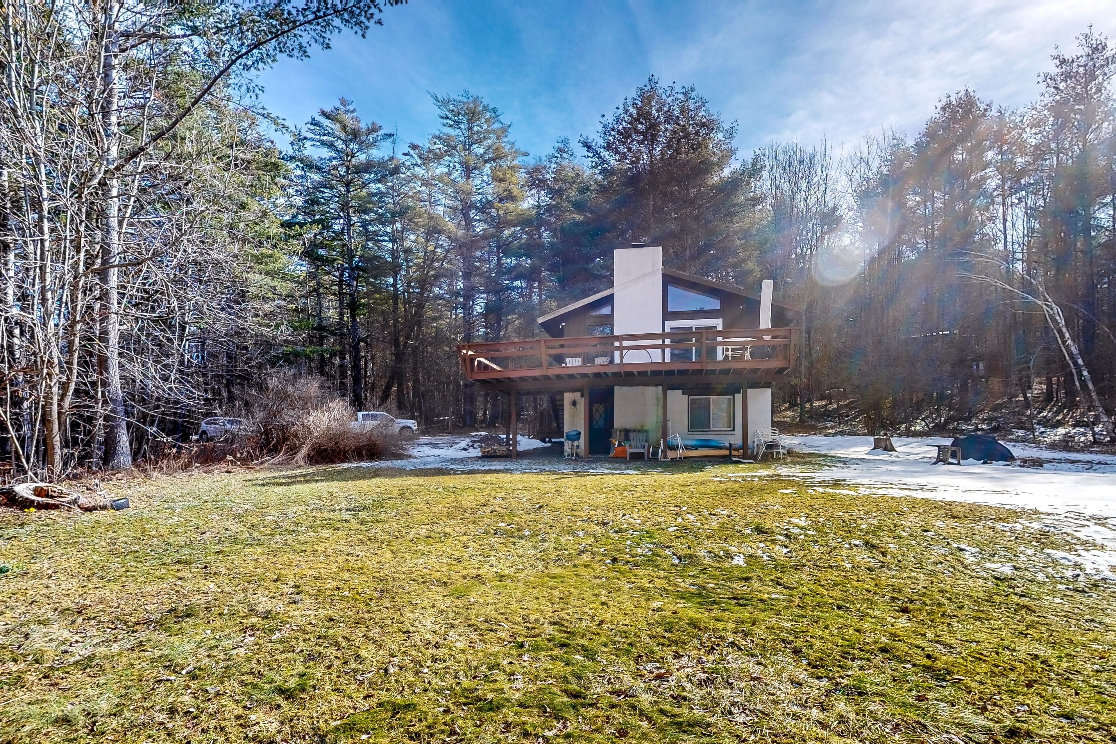 Two-story home with a fireplace & deck - across the street from lake access