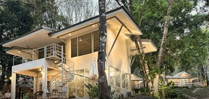 A modern, two-story house with a balcony, large windows, and a staircase. - Arb Pa Home & Cafe at Mae On (Mae On)