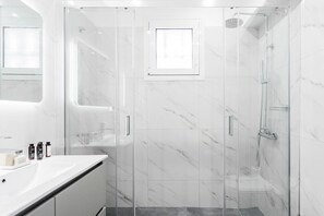 Shower, hair dryer, towels, soap