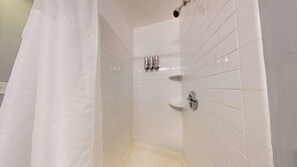 Shower, hair dryer, towels, shampoo