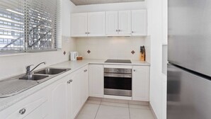Private kitchen - Welcome to your seaside sanctuary at Wyuna Apartments! (Gold Coast)