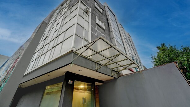 A modern building with a geometric facade and a glass entrance. - Hotel O near Monas formerly Cideng Timur Residence (Jakarta)