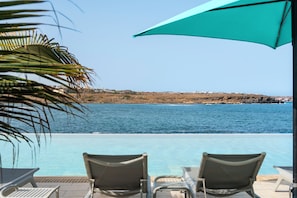 Outdoor pool, pool umbrellas, pool loungers