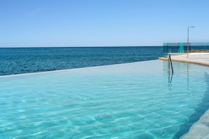 Outdoor pool, pool umbrellas, sun loungers