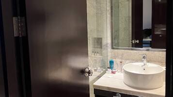 Shower, rainfall showerhead, towels, soap