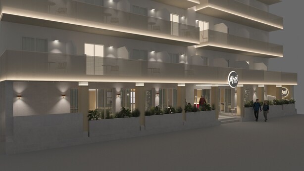 A modern hotel with a flat roof, multiple balconies, and a well-lit entrance. - AHOI! Urban Beach Hotel (Palma de Mallorca)
