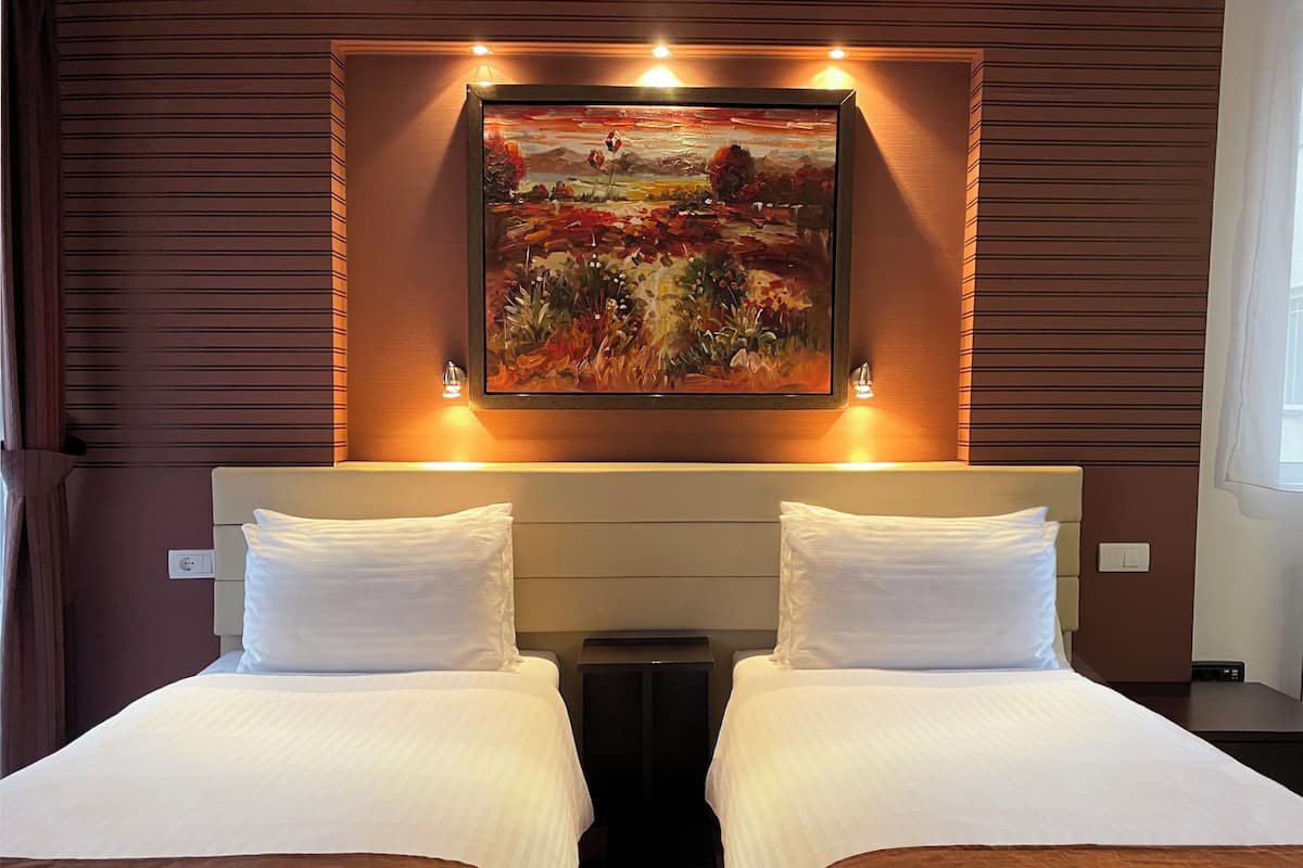 Premium bedding, down duvets, individually decorated