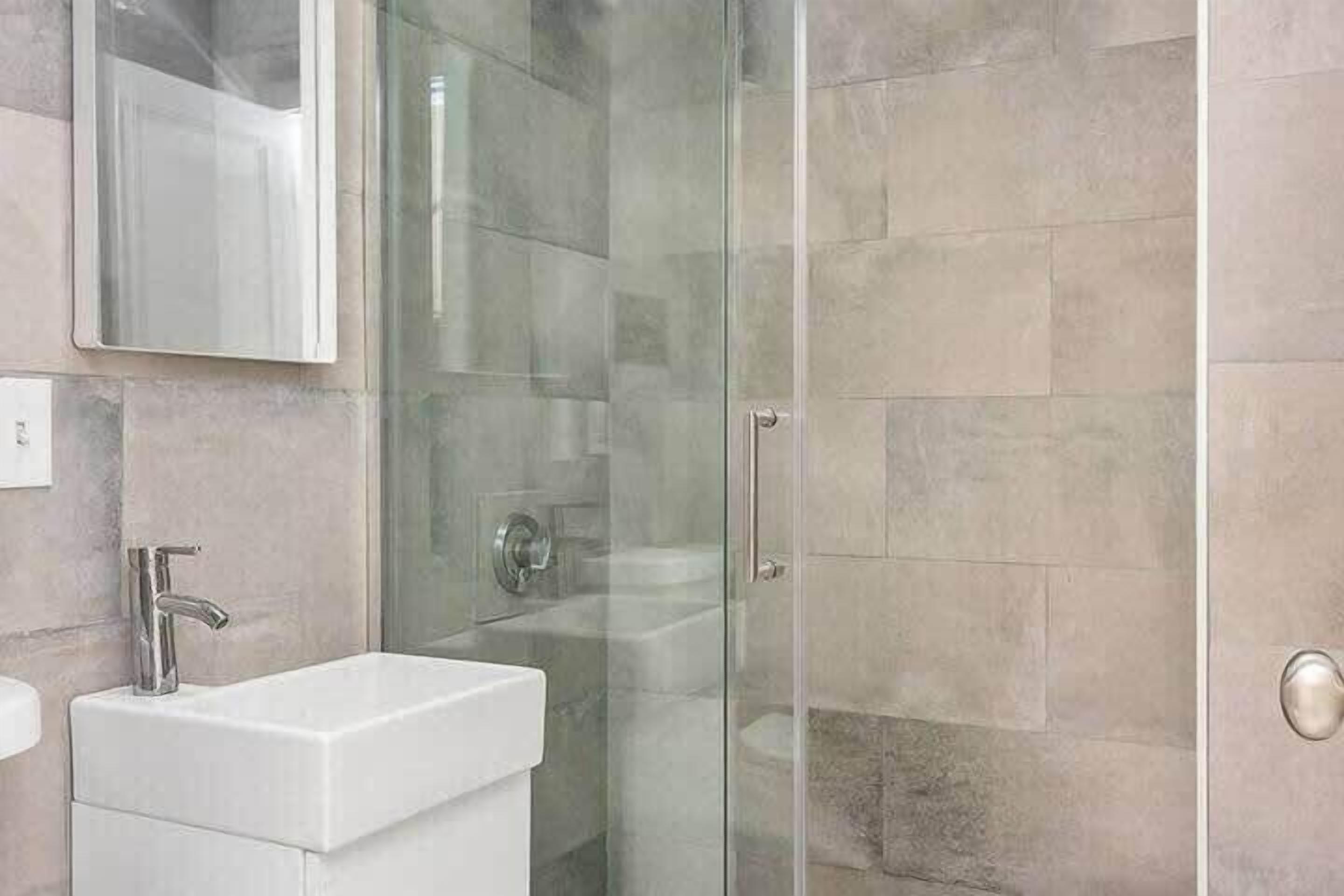 Shower, hair dryer, towels, shampoo